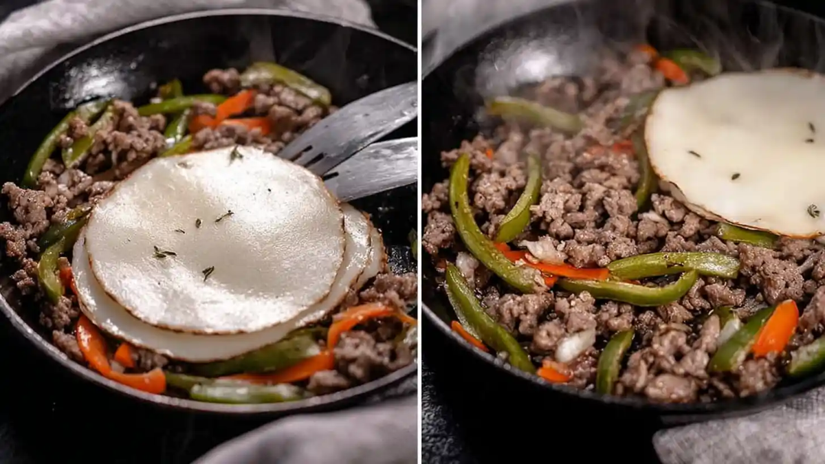 Sautéed ground beef with green and red bell peppers topped with melting provolone cheese in a cast iron skillet.